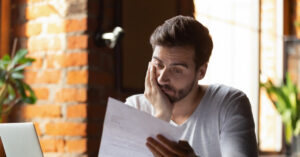 Man reading loan document