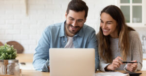 Couple looking at preapproved vs prequalified loan offers